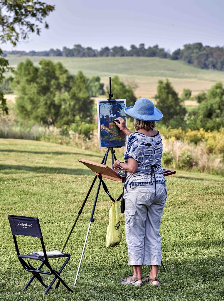 Artist painting outside during Fresh Paint (Plein Air)